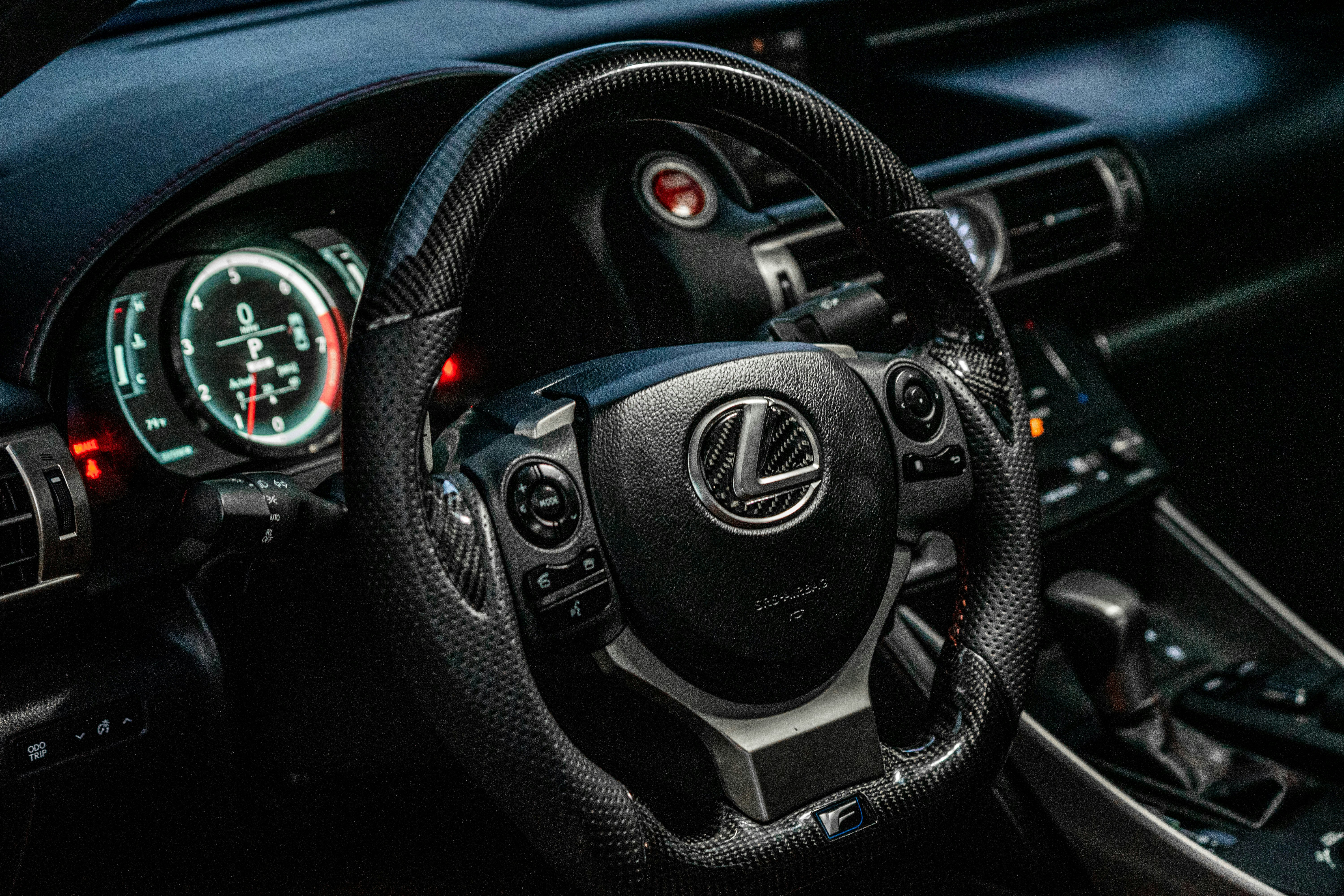 black and gray nissan steering wheel
